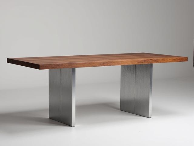 Modern bespoke metal dining table with a finely polished metallic finish and wooden top.